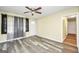 Bright living room featuring stylish curtains, ceiling fan, and modern flooring with access to the kitchen at 758 King Rd, Jonesboro, GA 30236