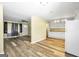 Open concept living room with view of kitchen with white cabinets and granite countertops at 758 King Rd, Jonesboro, GA 30236