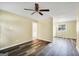 Bright living room featuring modern flooring with view into kitchen featuring ample cabinet space at 758 King Rd, Jonesboro, GA 30236