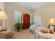 Bedroom featuring a decorative armoire, daybed and shutters at 127 Darwish Dr, Mcdonough, GA 30252