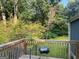 Relax on the deck and enjoy the view of the tree-lined backyard at 7138 Rockland Rd, Lithonia, GA 30038