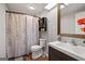 Charming bathroom with vanity, toilet, and shower boasting a patterned curtain at 7138 Rockland Rd, Lithonia, GA 30038