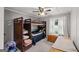 Functional bedroom featuring a bunk bed, dresser, and ample natural light for a cozy retreat at 7138 Rockland Rd, Lithonia, GA 30038