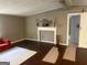 A view of the living room featuring a fireplace, mantel, and barn door at 7138 Rockland Rd, Lithonia, GA 30038