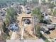 An aerial view of a two-story home showcasing its large lot and proximity to mature trees at 8870 Dornoch Cir, Winston, GA 30187