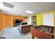 Finished basement with a foosball table, TV, and yellow walls offers a versatile entertainment area at 8870 Dornoch Cir, Winston, GA 30187