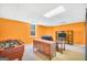 Finished basement with TV, seating, and foosball table shows entertainment potential at 8870 Dornoch Cir, Winston, GA 30187