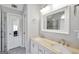 Bathroom with dual sinks, spacious mirror, and a separate shower area for convenience at 8870 Dornoch Cir, Winston, GA 30187