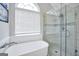 Bright bathroom with a soaking tub and a glass-enclosed shower, complemented by natural light at 8870 Dornoch Cir, Winston, GA 30187