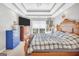 Main bedroom offering a comfortable bed, bright window, and stylish decor elements at 8870 Dornoch Cir, Winston, GA 30187