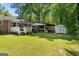 Spacious backyard with a deck and storage shed, offering plenty of room for outdoor enjoyment and storage at 118 Duvall Dr, Stockbridge, GA 30281