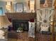 Cozy living room fireplace with charming decor, perfect for gatherings and quiet evenings at 118 Duvall Dr, Stockbridge, GA 30281