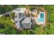 Aerial view showcasing a gunite pool, multilevel patio and lush landscape, creating a private outdoor retreat at 104 Hidden Springs Ln, Peachtree City, GA 30269