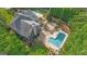 Aerial view of the pool, landscaping and exterior, creating a backyard perfect for outdoor relaxation at 104 Hidden Springs Ln, Peachtree City, GA 30269