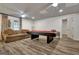 Recreational basement with a pool table, comfortable seating, and access to the outdoors at 104 Hidden Springs Ln, Peachtree City, GA 30269