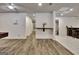The finished basement with wood floors includes an entertainment area with a bar and extra storage at 104 Hidden Springs Ln, Peachtree City, GA 30269