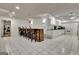 Finished basement features a bar area, a full kitchen, and tiled floors at 104 Hidden Springs Ln, Peachtree City, GA 30269