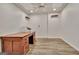 Basement office with hardwood floors, a fan, and a wooden desk at 104 Hidden Springs Ln, Peachtree City, GA 30269