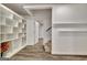 Basement with built in shelves, carpeted stairs, and hardwood floors at 104 Hidden Springs Ln, Peachtree City, GA 30269