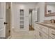 Bright bathroom with a glass shower, vanity with stone countertops, and a built in shelf at 104 Hidden Springs Ln, Peachtree City, GA 30269