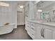 Elegant bathroom showcasing a modern freestanding tub, marble countertops, and stylish cabinetry at 104 Hidden Springs Ln, Peachtree City, GA 30269