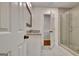 A modern bathroom featuring a glass-enclosed shower, vanity, and white cabinets at 104 Hidden Springs Ln, Peachtree City, GA 30269