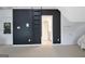 Bedroom with a black accent wall and ladder, adding a modern flair to this space at 104 Hidden Springs Ln, Peachtree City, GA 30269