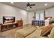 Finished bedroom with hardwood floors, large window for natural light, and ceiling fan at 104 Hidden Springs Ln, Peachtree City, GA 30269