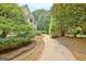 A curved driveway and lush landscaping welcomes you to this exceptional home at 104 Hidden Springs Ln, Peachtree City, GA 30269