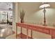 Elegant entryway featuring a wooden console table with a lamp, enhancing the welcoming atmosphere of the home at 104 Hidden Springs Ln, Peachtree City, GA 30269