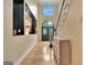 Grand foyer with hardwood floors, staircase, chandelier, and black double door entryway providing a bright welcome at 104 Hidden Springs Ln, Peachtree City, GA 30269