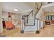 Elegant foyer featuring hardwood floors, a staircase, and an open floor plan at 104 Hidden Springs Ln, Peachtree City, GA 30269