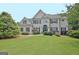 Well-maintained two story home with beautiful yard, landscaping, and traditional design at 104 Hidden Springs Ln, Peachtree City, GA 30269