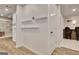 Hallway with hardwood floors, built in shelves, recessed lighting, and white walls at 104 Hidden Springs Ln, Peachtree City, GA 30269