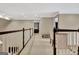 Bright hallway with neutral walls and carpet, featuring a charming desk and bench at 104 Hidden Springs Ln, Peachtree City, GA 30269