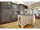 Kitchen with a center island, granite countertops, and stainless steel appliances at 104 Hidden Springs Ln, Peachtree City, GA 30269
