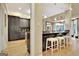 Open-concept kitchen featuring granite countertops and a breakfast bar with seating at 104 Hidden Springs Ln, Peachtree City, GA 30269