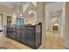 Kitchen with a breakfast bar island, stainless steel dishwasher and view to the living room at 104 Hidden Springs Ln, Peachtree City, GA 30269
