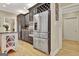 Kitchen with stainless steel refrigerator, built-in oven, and custom cabinets at 104 Hidden Springs Ln, Peachtree City, GA 30269