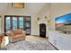 Comfortable living room featuring a fireplace, large glass doors, and a TV at 104 Hidden Springs Ln, Peachtree City, GA 30269