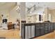 Kitchen with a breakfast bar island, stainless steel dishwasher and view to the living room at 104 Hidden Springs Ln, Peachtree City, GA 30269