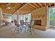An inviting outdoor patio with a fireplace and seating that adds comfort and style at 104 Hidden Springs Ln, Peachtree City, GA 30269
