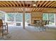 Relax on the outdoor patio with exposed beam ceiling and view of the backyard at 104 Hidden Springs Ln, Peachtree City, GA 30269