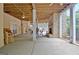 Spacious covered patio with multiple seating areas and an outdoor fireplace for entertaining at 104 Hidden Springs Ln, Peachtree City, GA 30269