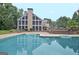 Expansive pool and screened-in porch on a multi-level deck create a relaxing outdoor retreat at 104 Hidden Springs Ln, Peachtree City, GA 30269