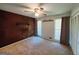 This bedroom features a carpet flooring and a ceiling fan at 1753 Brenda Dr, Jonesboro, GA 30236