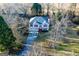 Inviting two-story home with red shutters, set in a serene location with mature trees at 402 Stonebrooke Dr, Auburn, GA 30011