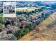 A beautiful aerial view of a home nestled amongst the trees in a suburban neighborhood at 402 Stonebrooke Dr, Auburn, GA 30011