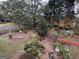 A verdant backyard with mature trees and a charming fire pit area for outdoor enjoyment at 402 Stonebrooke Dr, Auburn, GA 30011