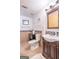 Charming bathroom with dark wood vanity and backsplash, providing a clean and pleasant space at 402 Stonebrooke Dr, Auburn, GA 30011